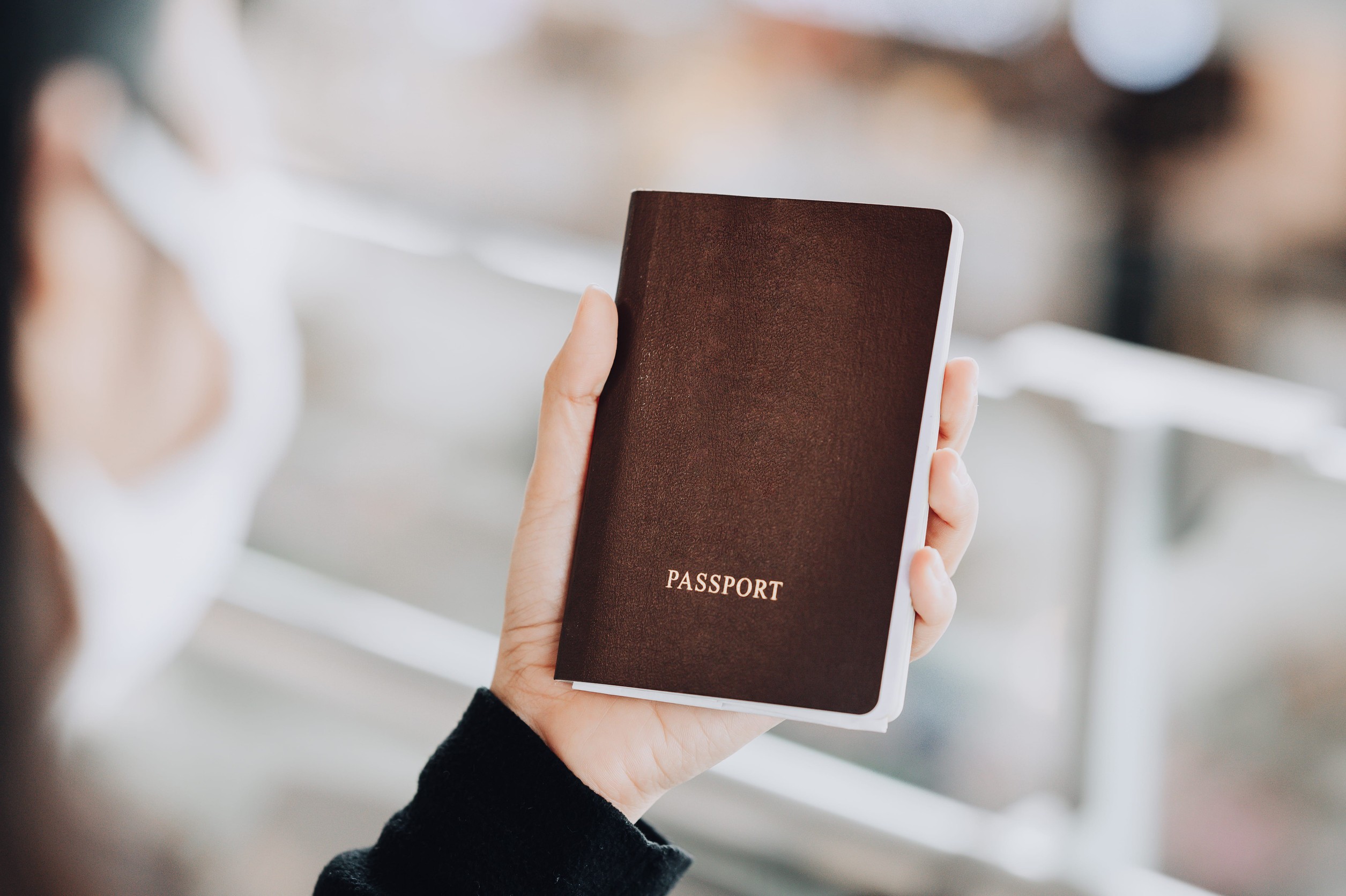 Asian Woman Looking Our Passport