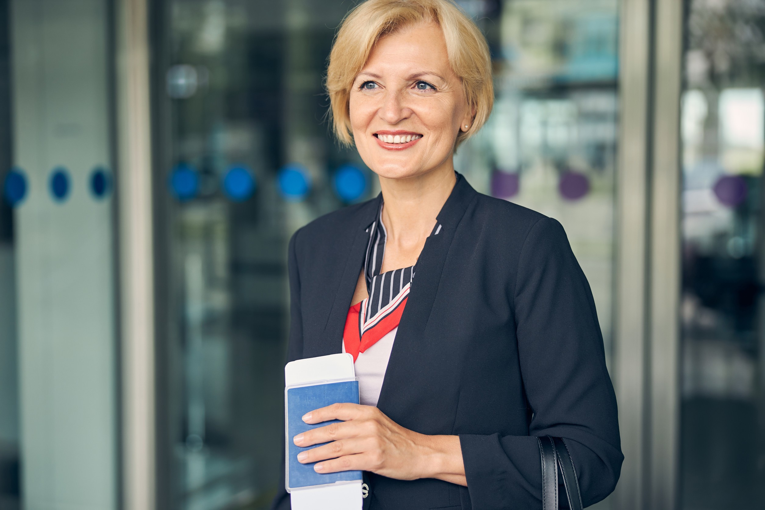 Businesswoman Holding Passport And Ticket