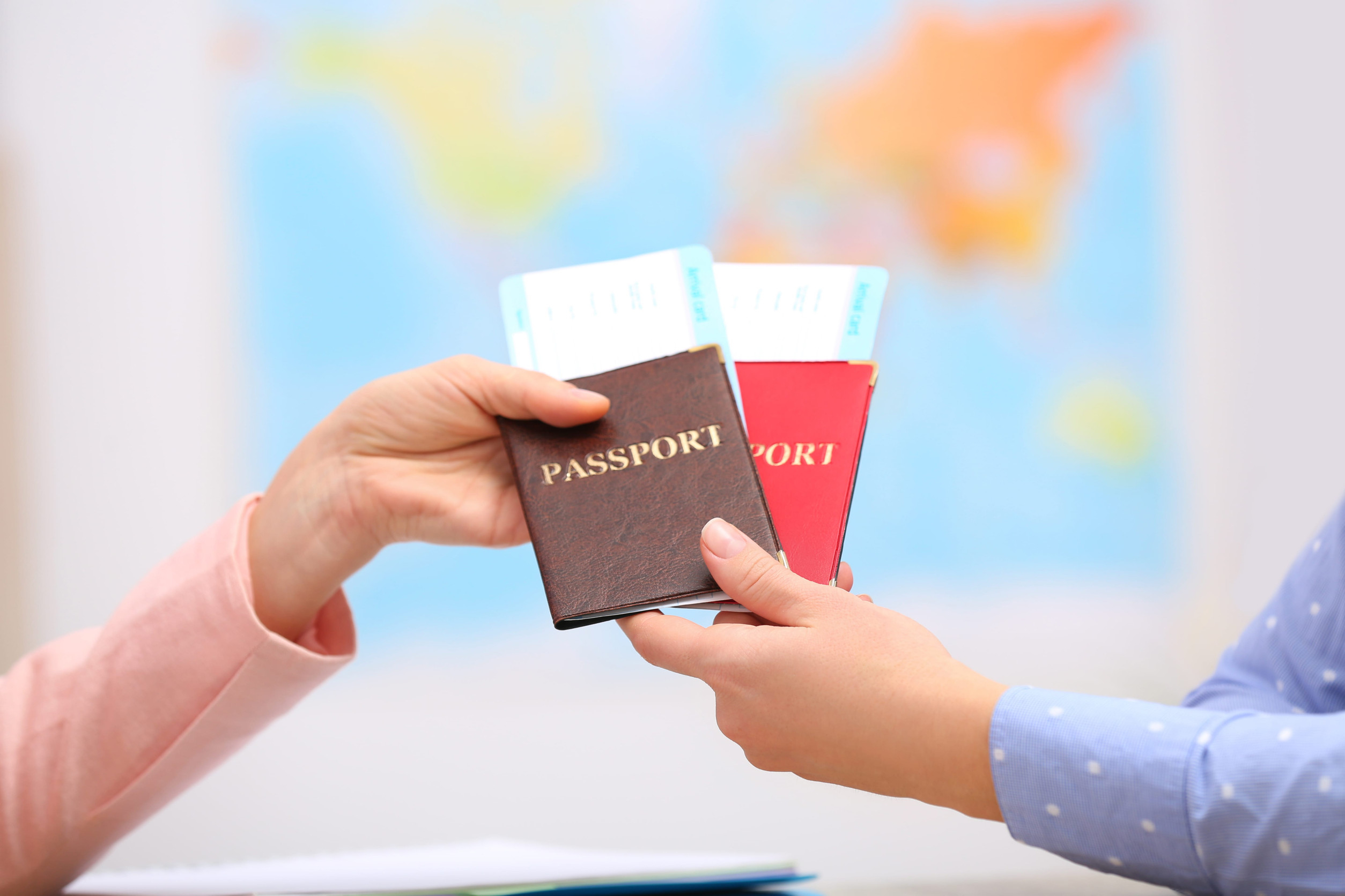 Female Manager Giving Passports With Tickets To Client