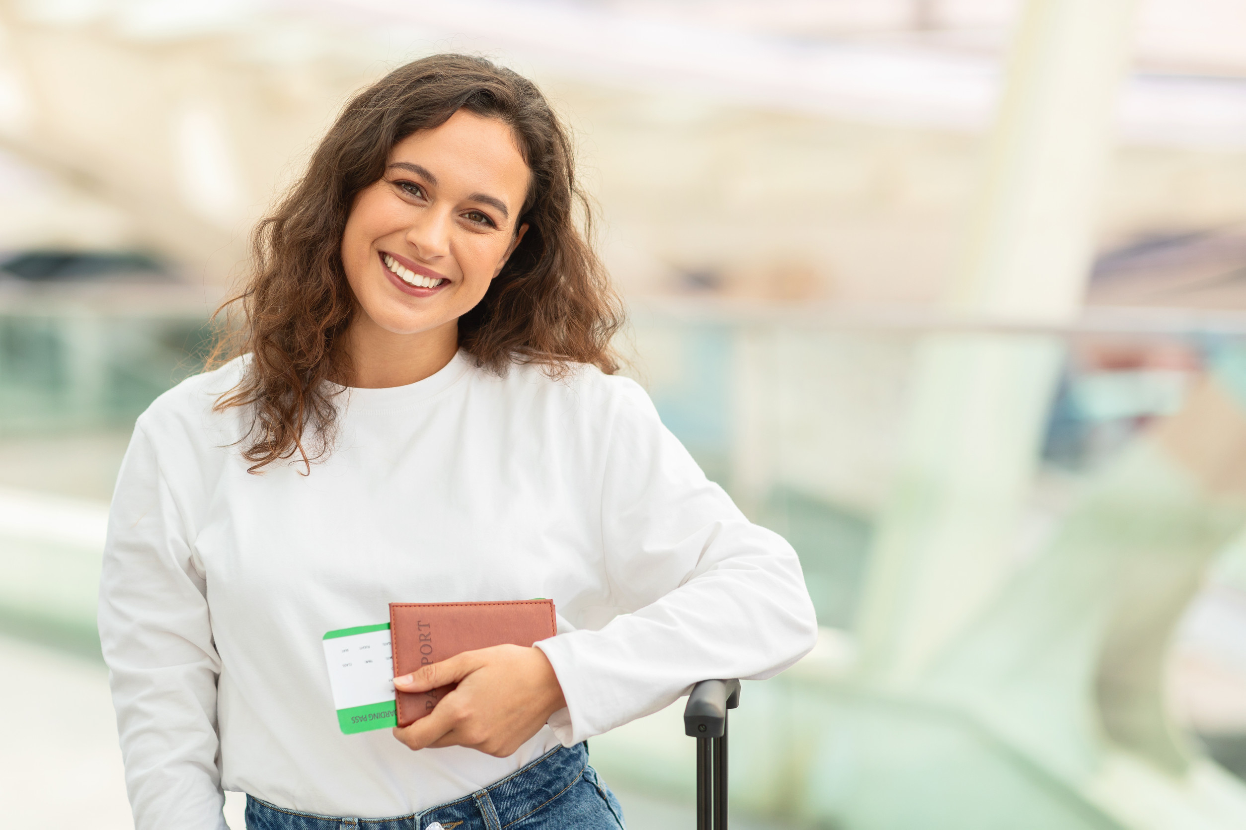 Happy Traveler Holding Passport And Tickets