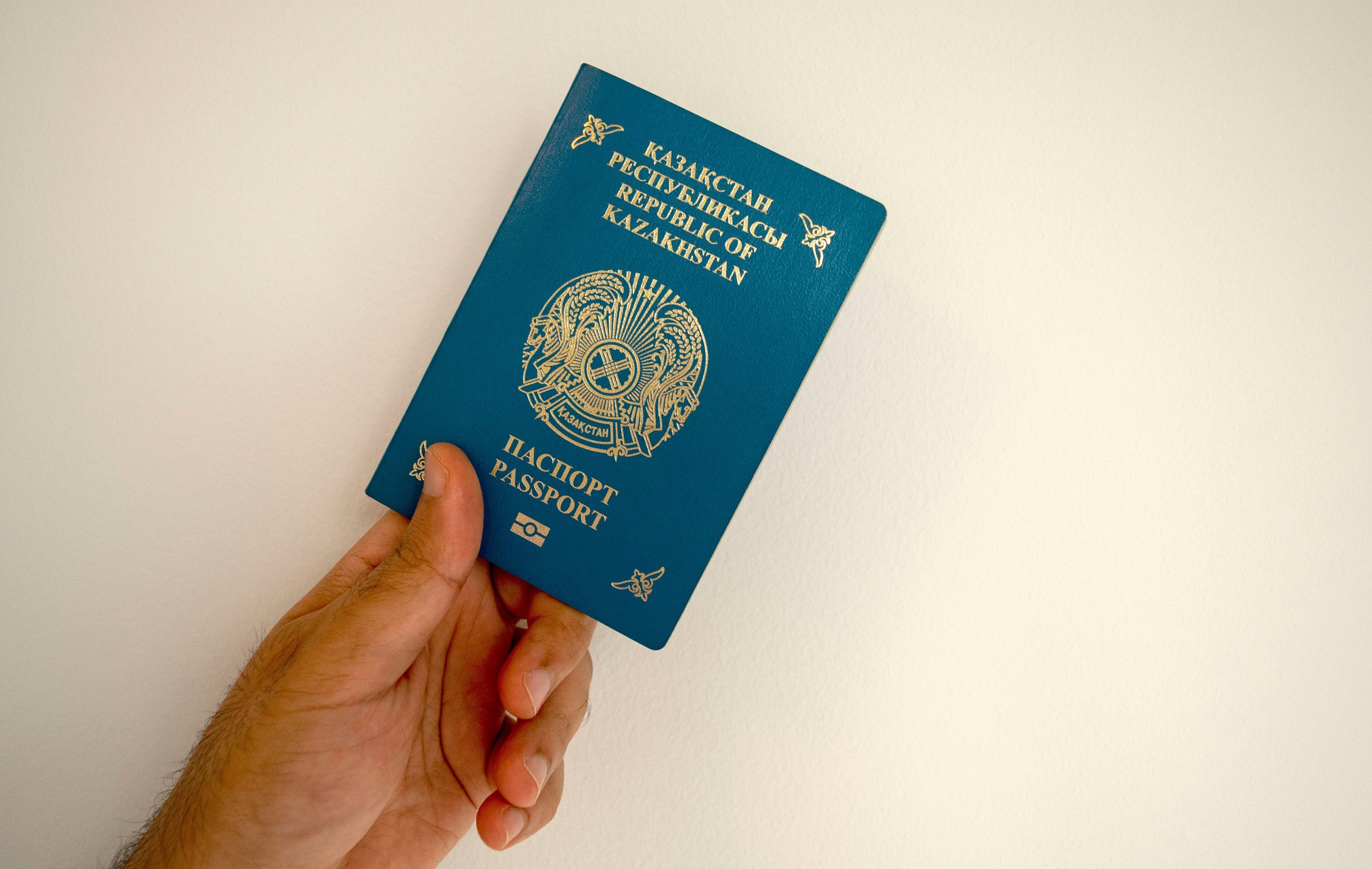 Kazakhstan Passport In Male Hand