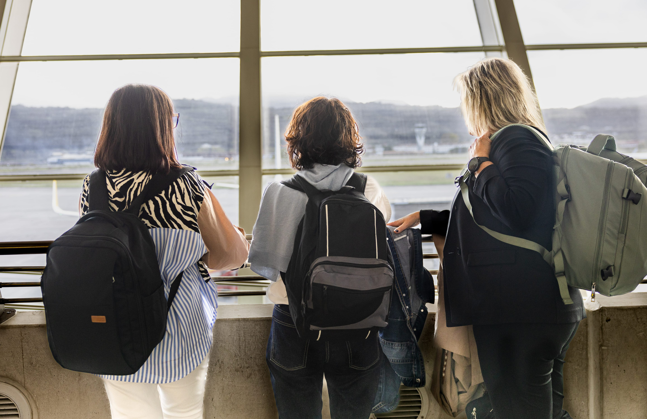 Three Travellers Waiting For Departure