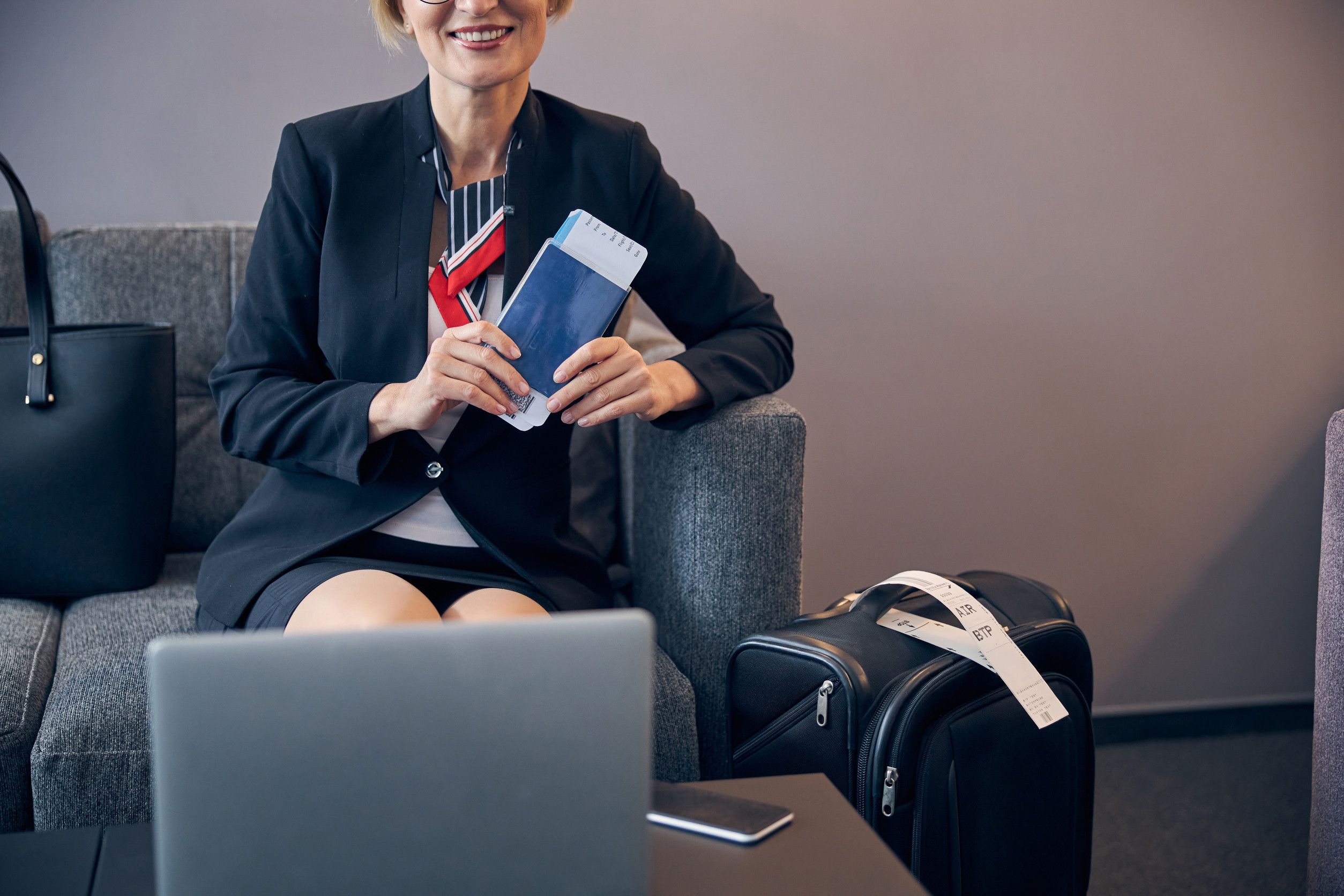 Woman Holding Passport And Airplane Ticket