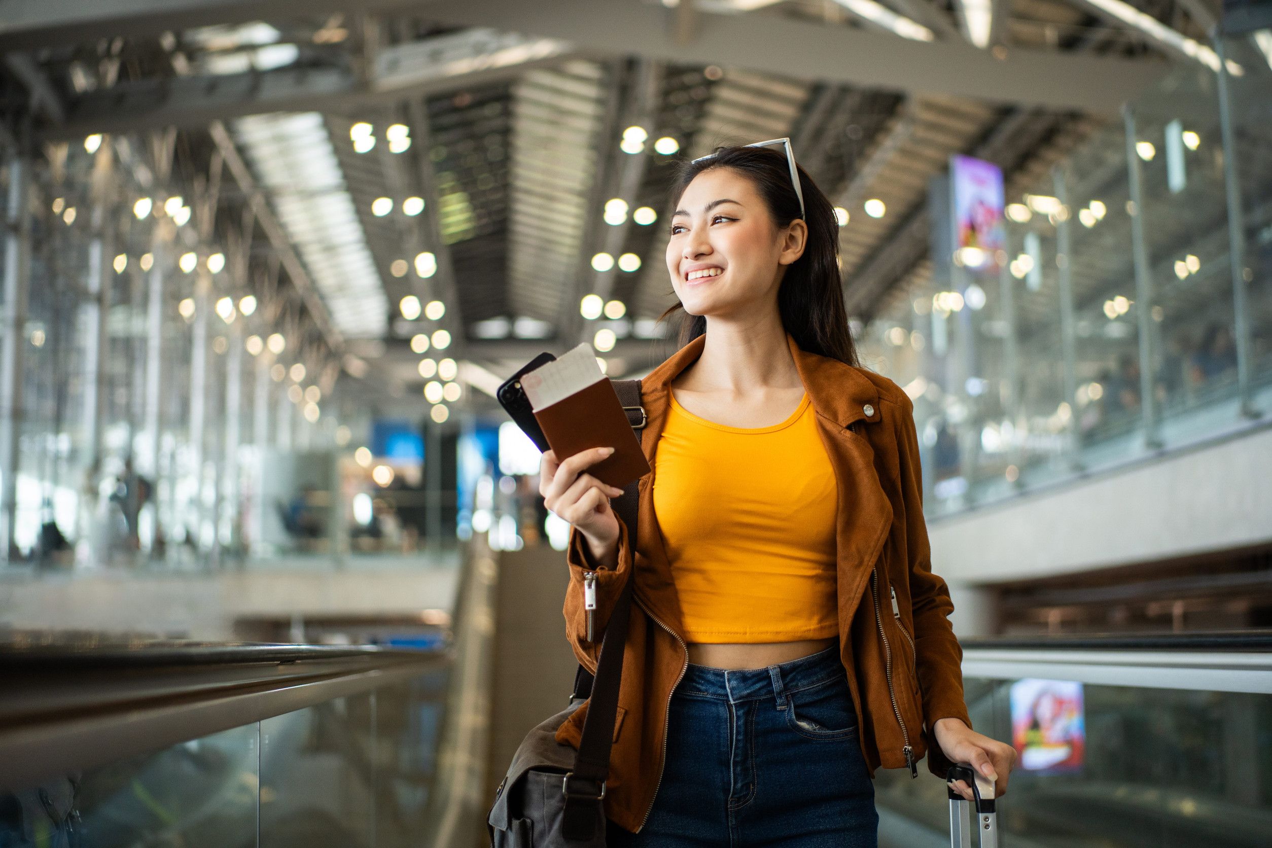 Young Asian Woman Holding Passport