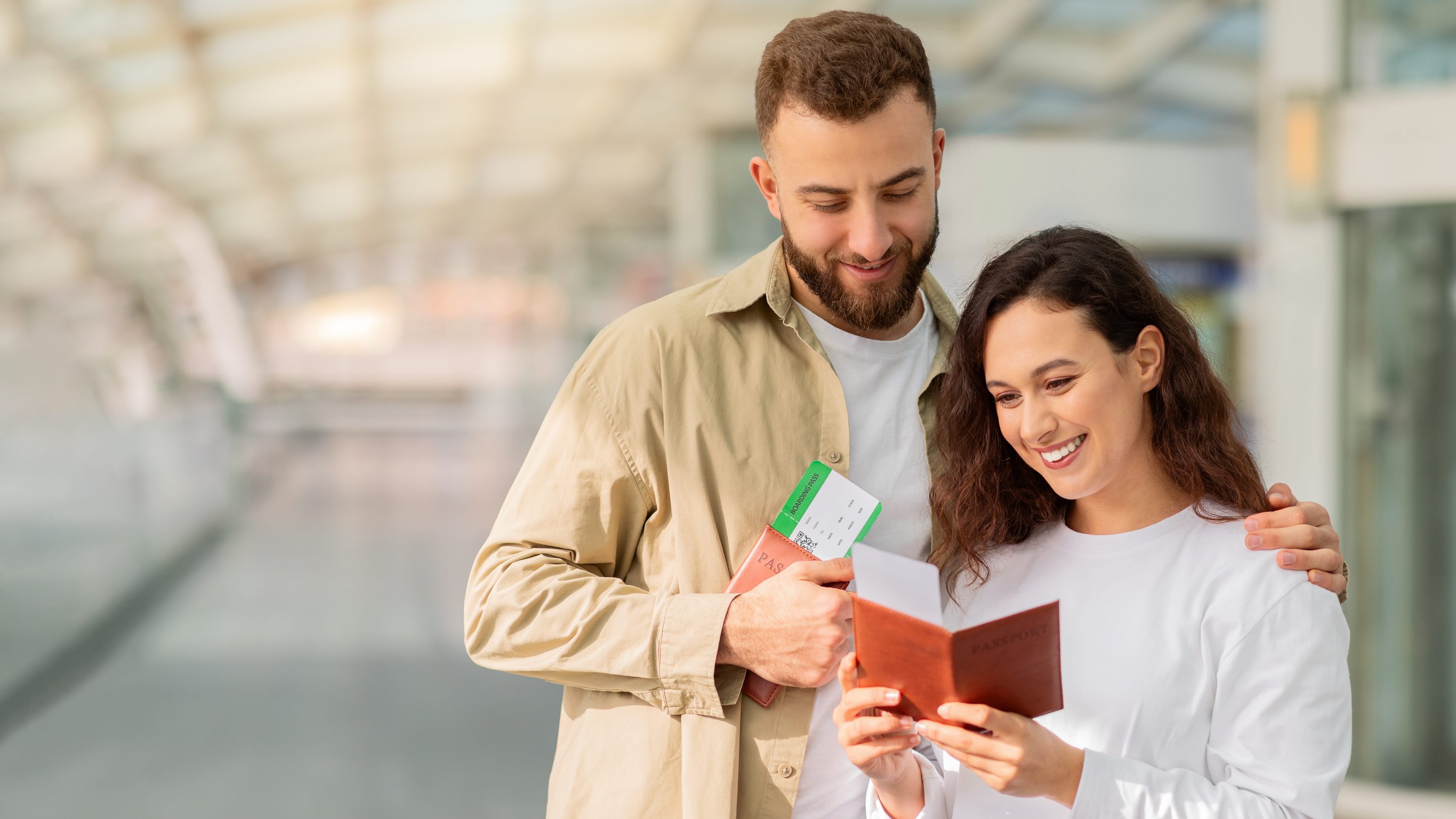 Young Happy Couple Checking Passports