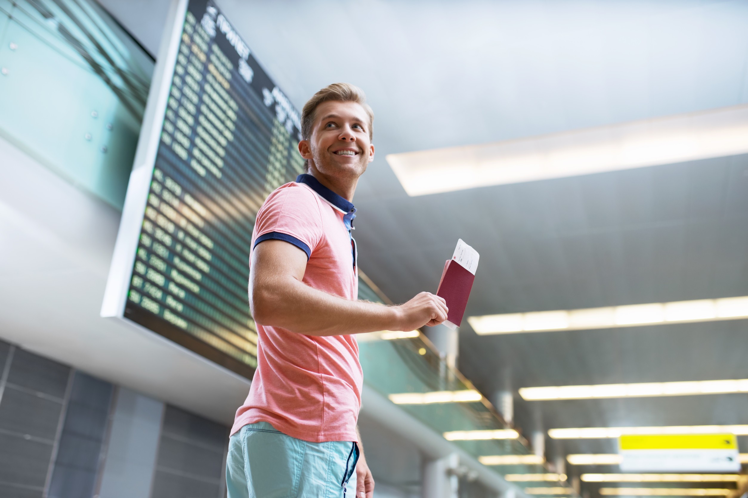 Young Man With A Passport At The Board