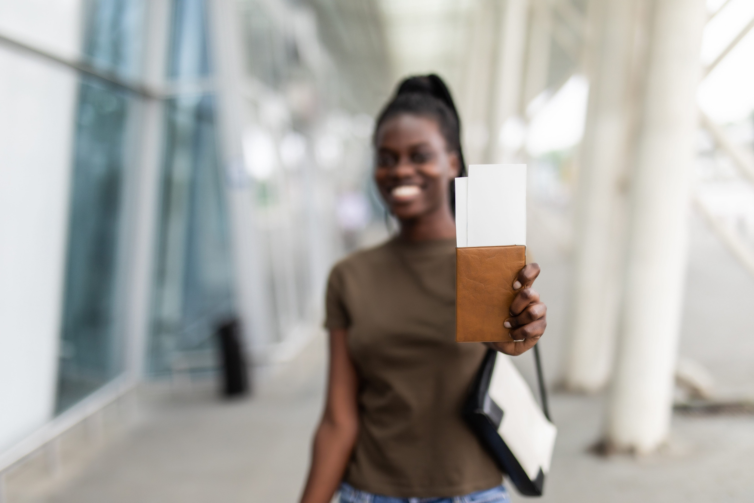 Young Pretty African Woman Holding Passport