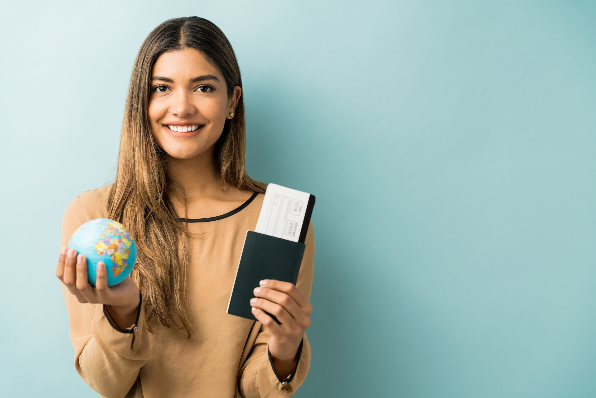 Young Woman Holding Passport And Boarding Pass